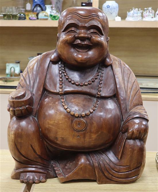 A large carved hardwood Buddha height 54cm
